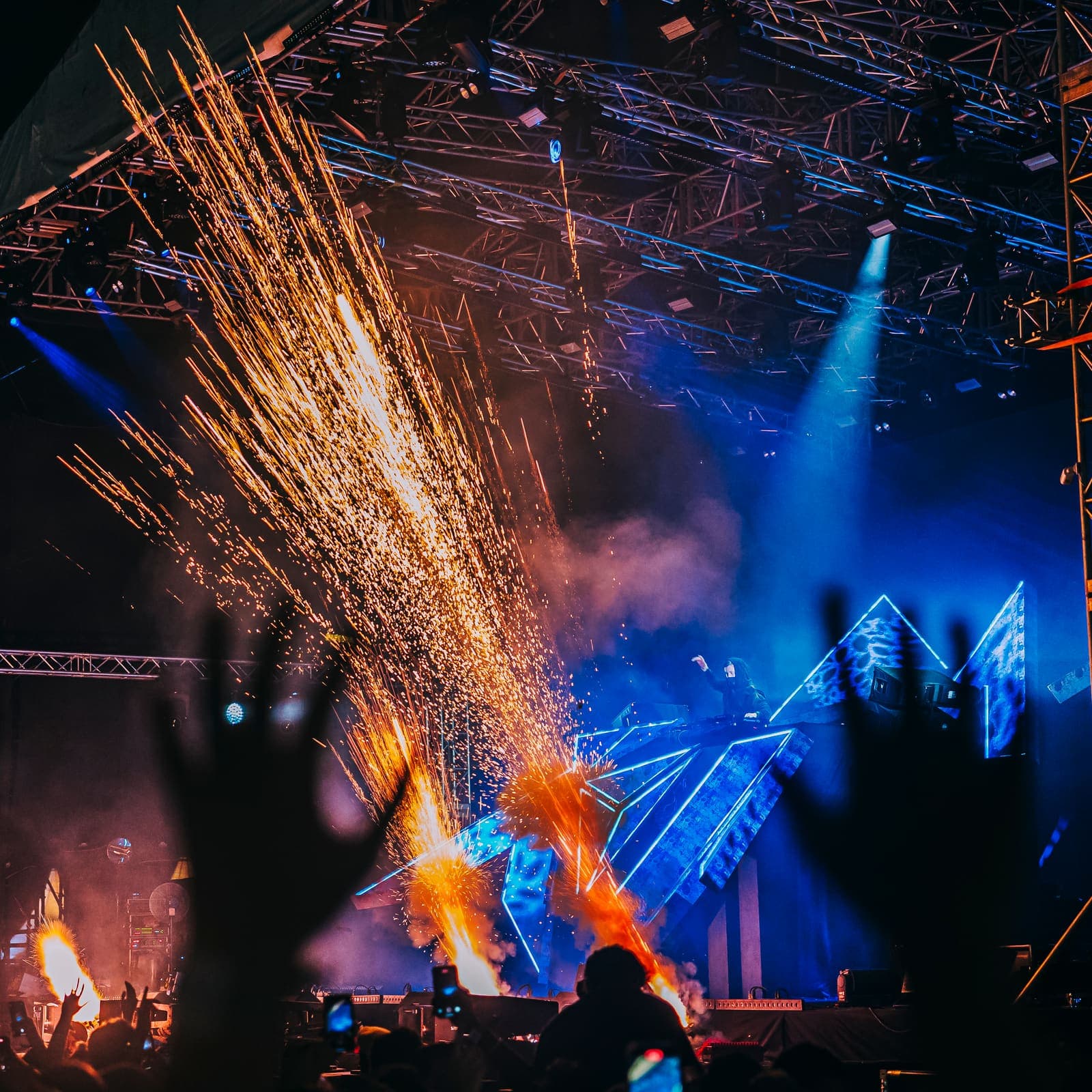Sparks raining over a concert stage
