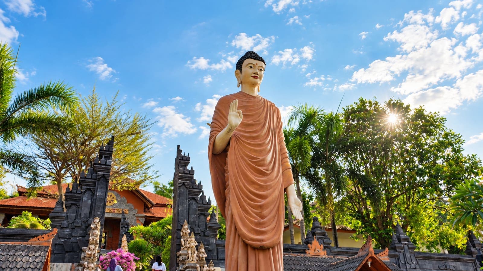 Giant statue at a Balinese temple under blue sky